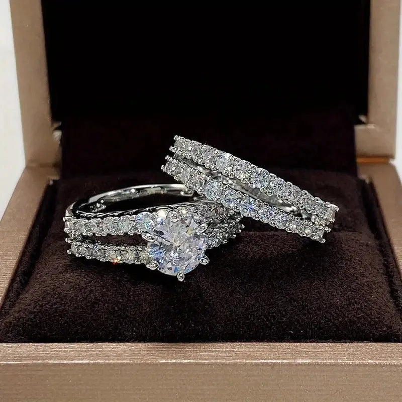 2-in-1 fully-jewelled female ring set in geometric design with round elements, shown in silver, gold and rose gold finishes