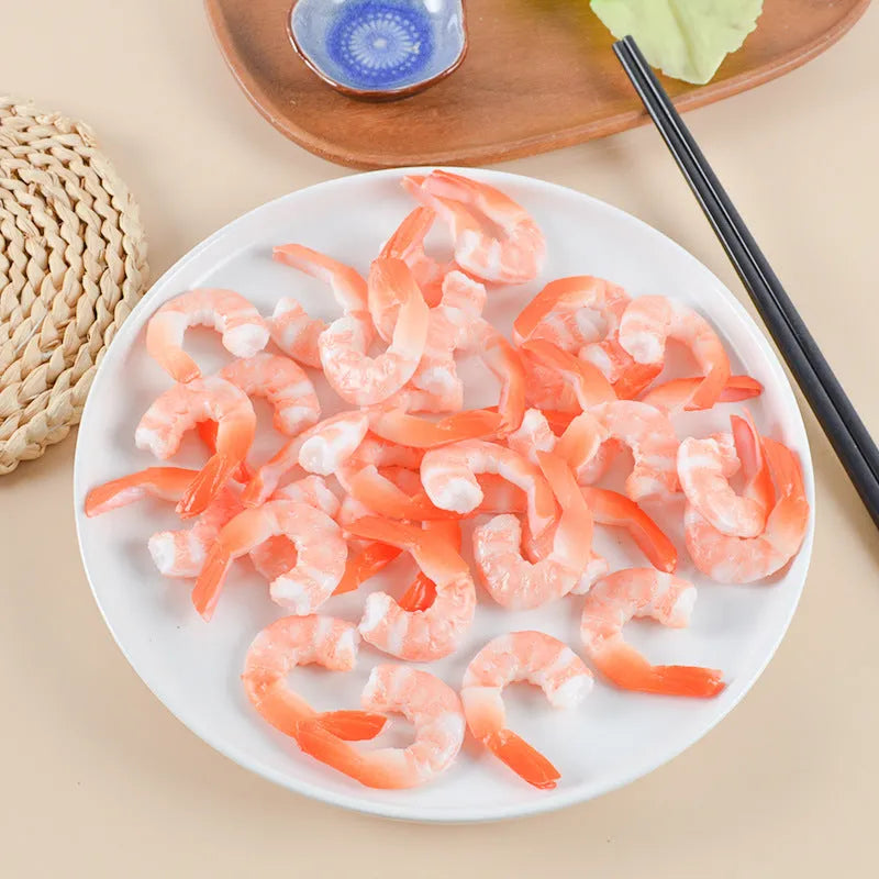 PVC injection moulded shrimp-shaped keychain with door buckle function, shown in modern simplicity style.