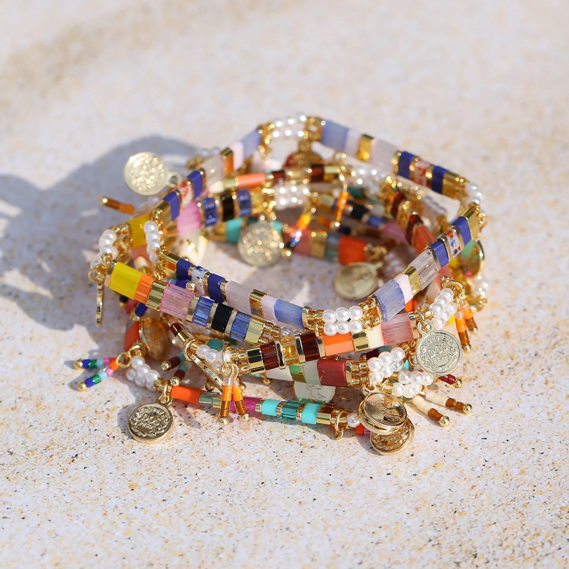Women's handmade bracelet with glass coloured imitation pearl beads on wrist, showing one of six available colour styles.