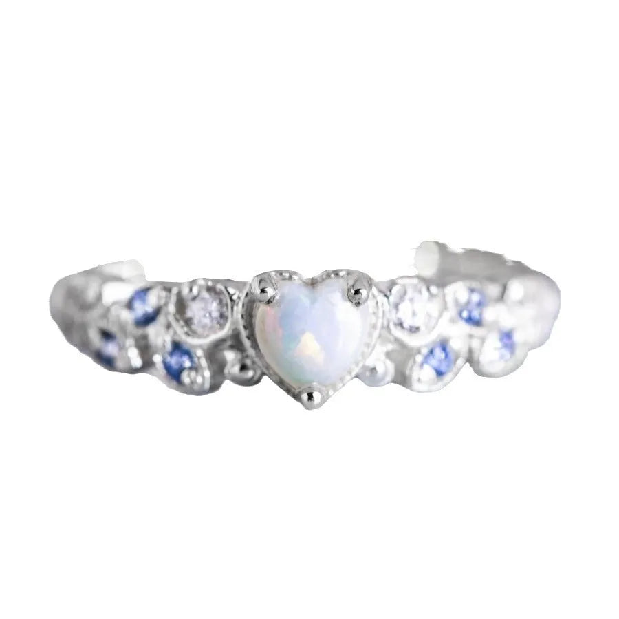 Women's white heart-shaped ring with flower opal ocean pattern detail in peach heart design