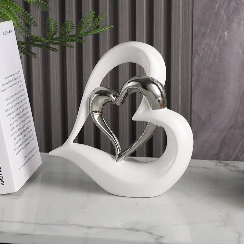 Modern white porcelain heart ornament on display in a choice of eight metallic and coloured finishes.
