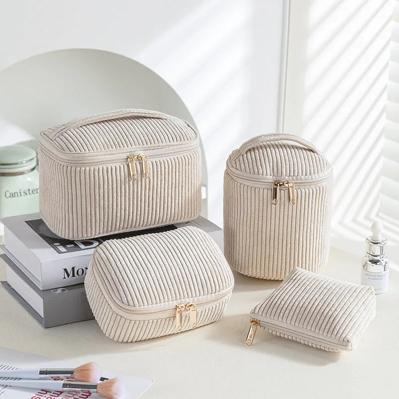 Four-piece set of cube-shaped flannelette makeup bags in a choice of colours.