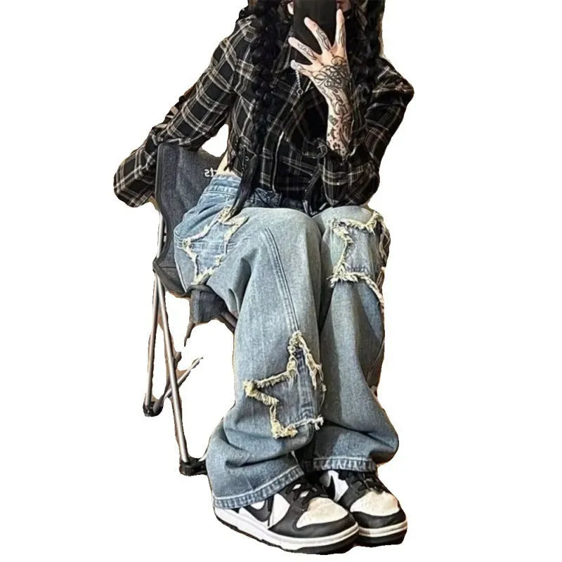Women's wash blue high-waist straight-leg denim jeans on a hanger.