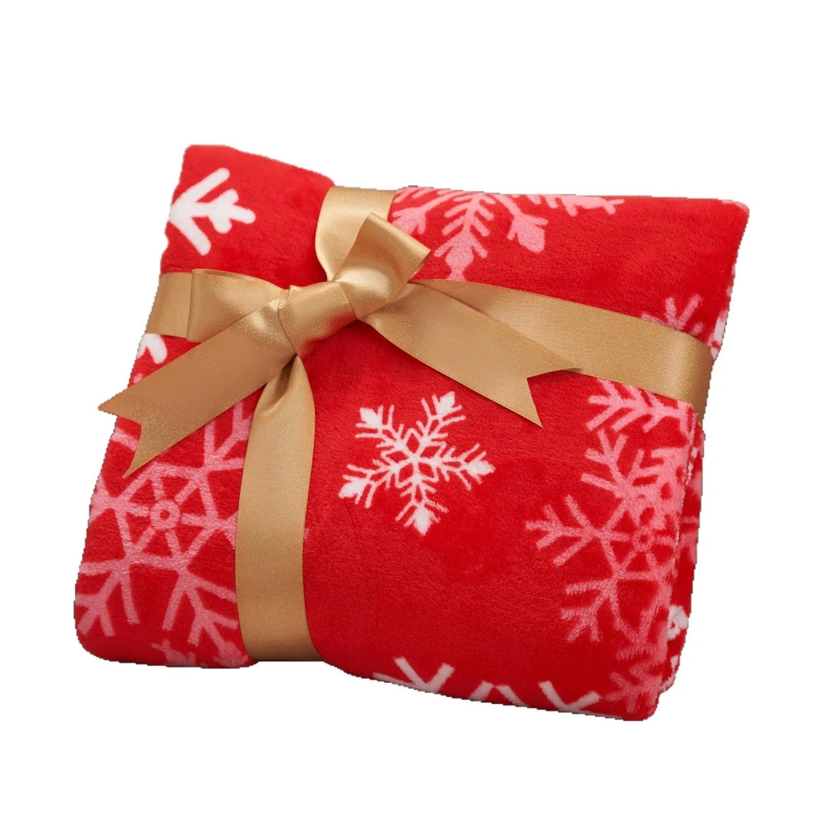 Soft red plush Christmas blanket draped over a sofa, showing its textured flannel fabric.