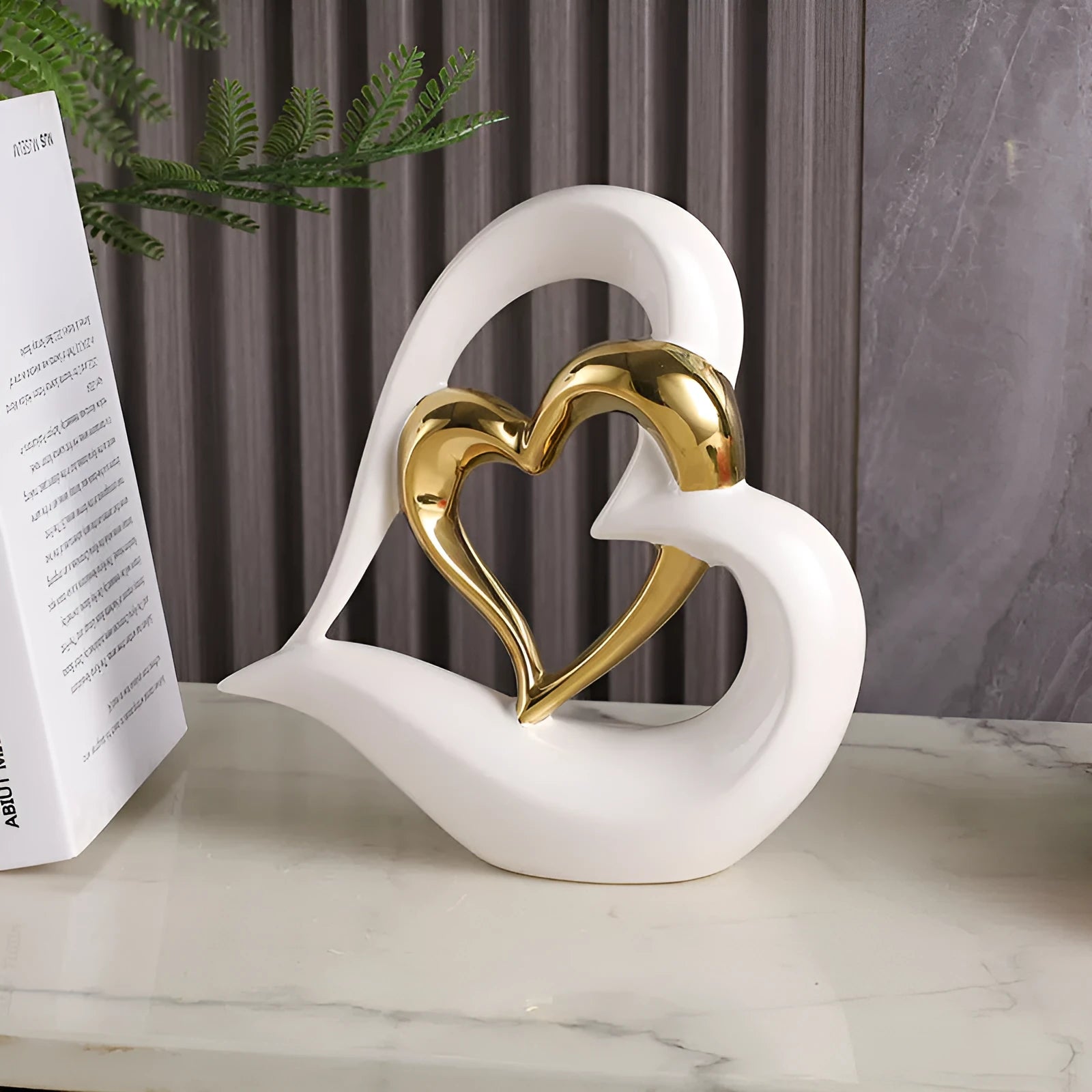 Modern white porcelain heart ornament on display in a choice of eight metallic and coloured finishes.