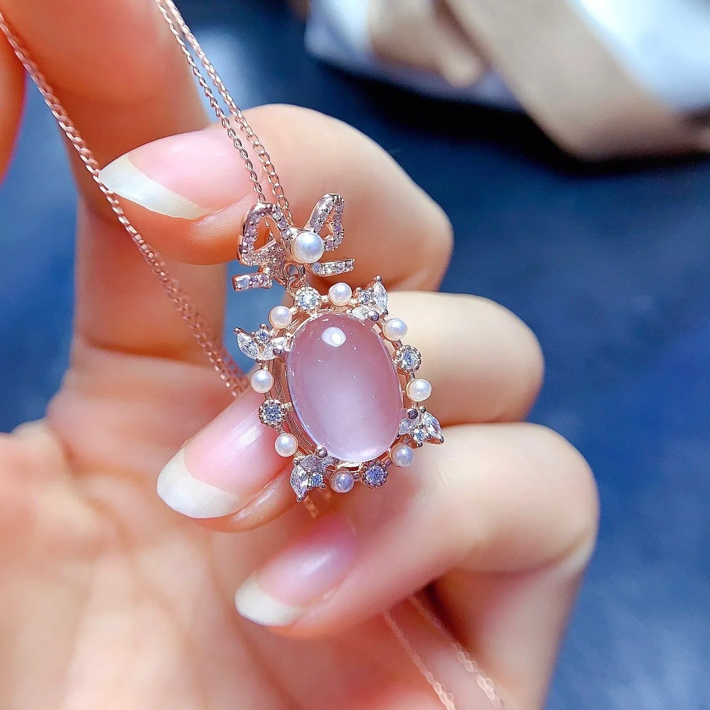 Natural pink rose quartz geometric pendant on a rose gold plated sterling silver necklace.