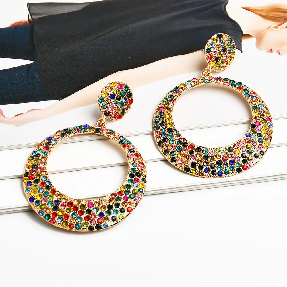 Large round pendant alloy earrings with colourful diamond cartoon design on a white background.