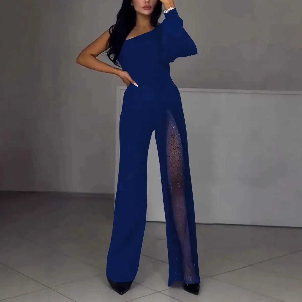 Women's black polyester jumpsuit with oblique shoulder design and high slit skirt, long sleeves
