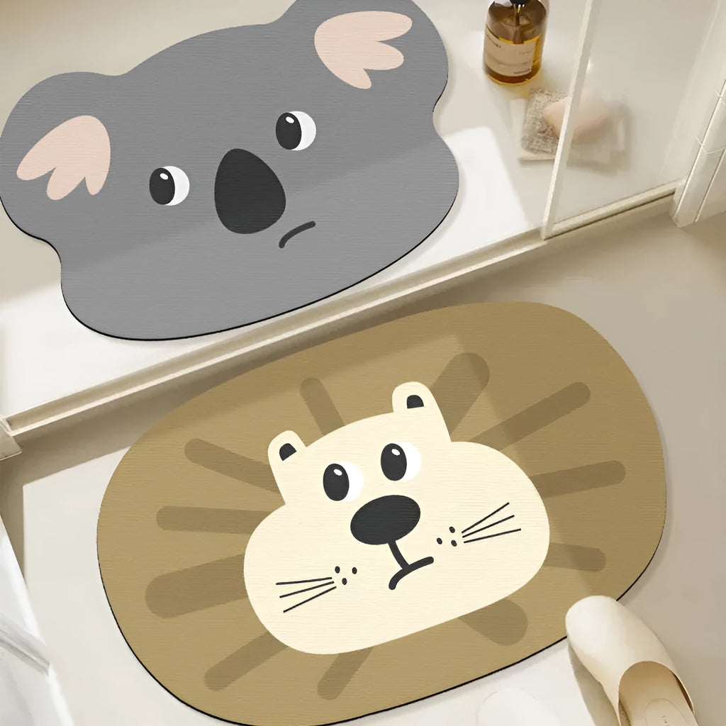 Cute cartoon animal diatomaceous earth bath mat in alien shape on bathroom floor.
