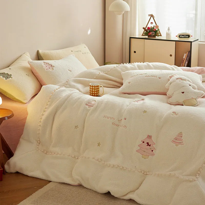 Milk fibre four-piece bedding set with green Christmas tree pattern on a duvet cover and pillowcases.