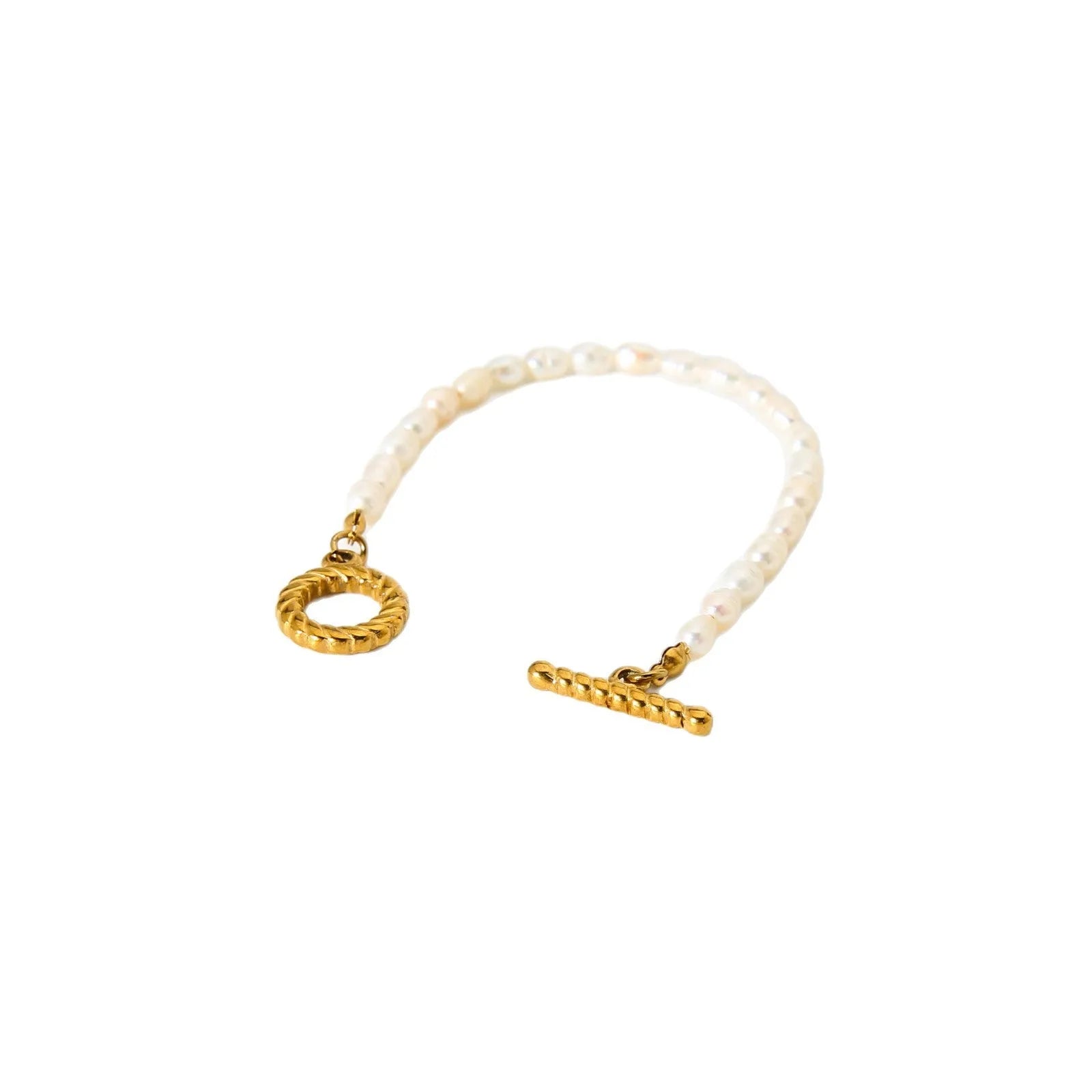 Women's freshwater pearl and geometric stainless steel necklace and bracelet set on a grey background