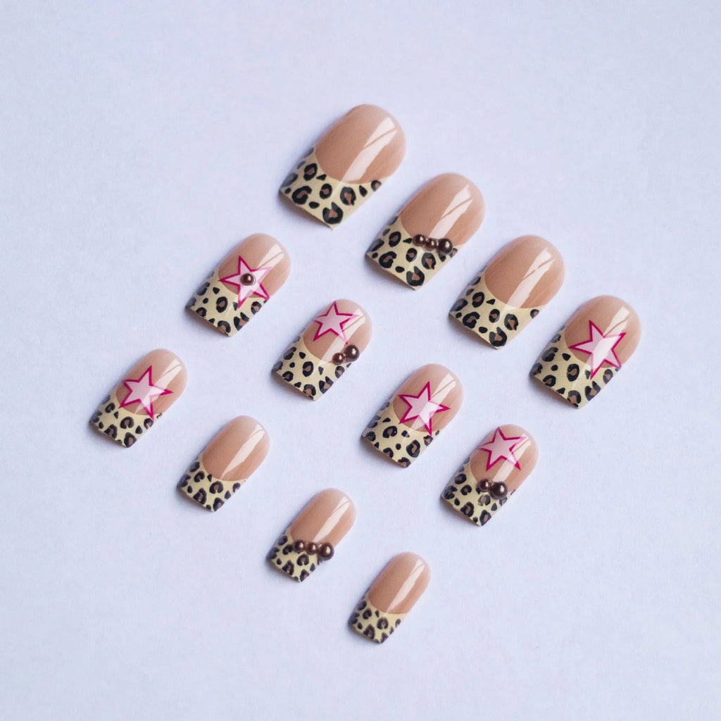 French manicure press on nails with leopard print pattern, star and pearl diamond accents