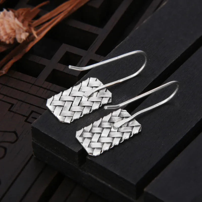 Geometric diamond plaid woven earrings in sterling silver measuring 17.5mm by 11mm