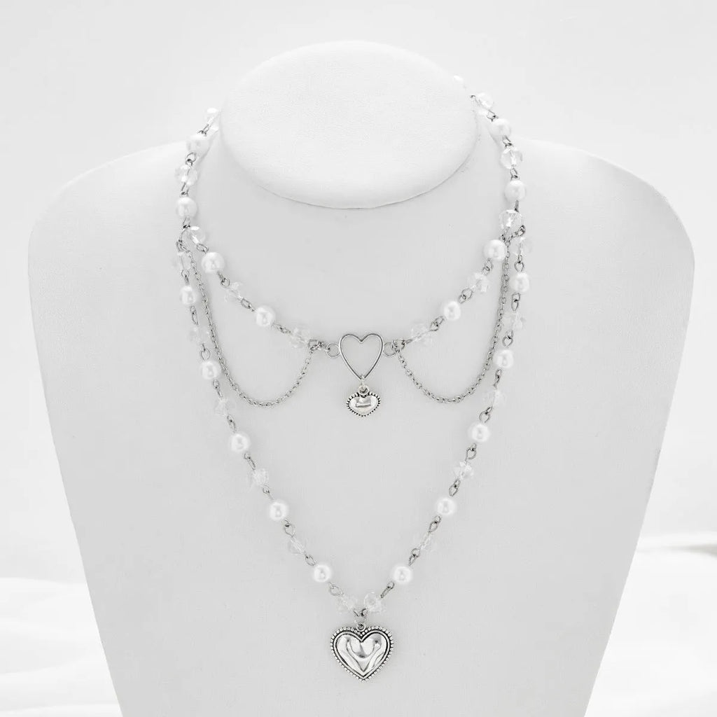 Women's retro alloy love heart pendant necklace with multi-layer pearl chain and double-layer heart design