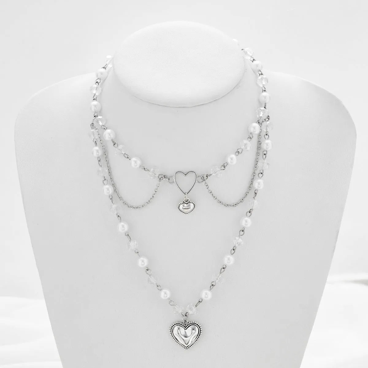 Women's retro alloy love heart pendant necklace with multi-layer pearl chain and double-layer heart design