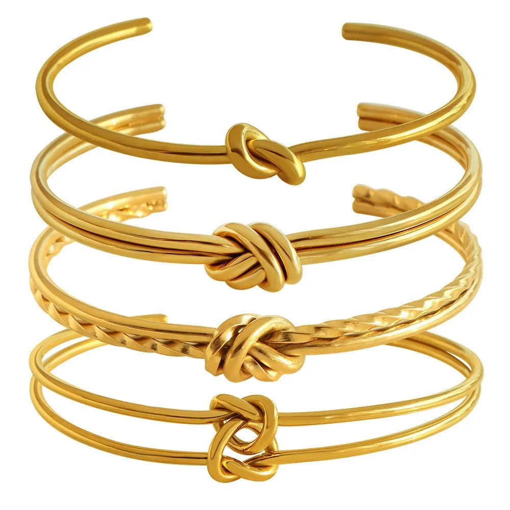 Adjustable stainless steel bracelet with 18K gold plating and knotted C-shaped open design