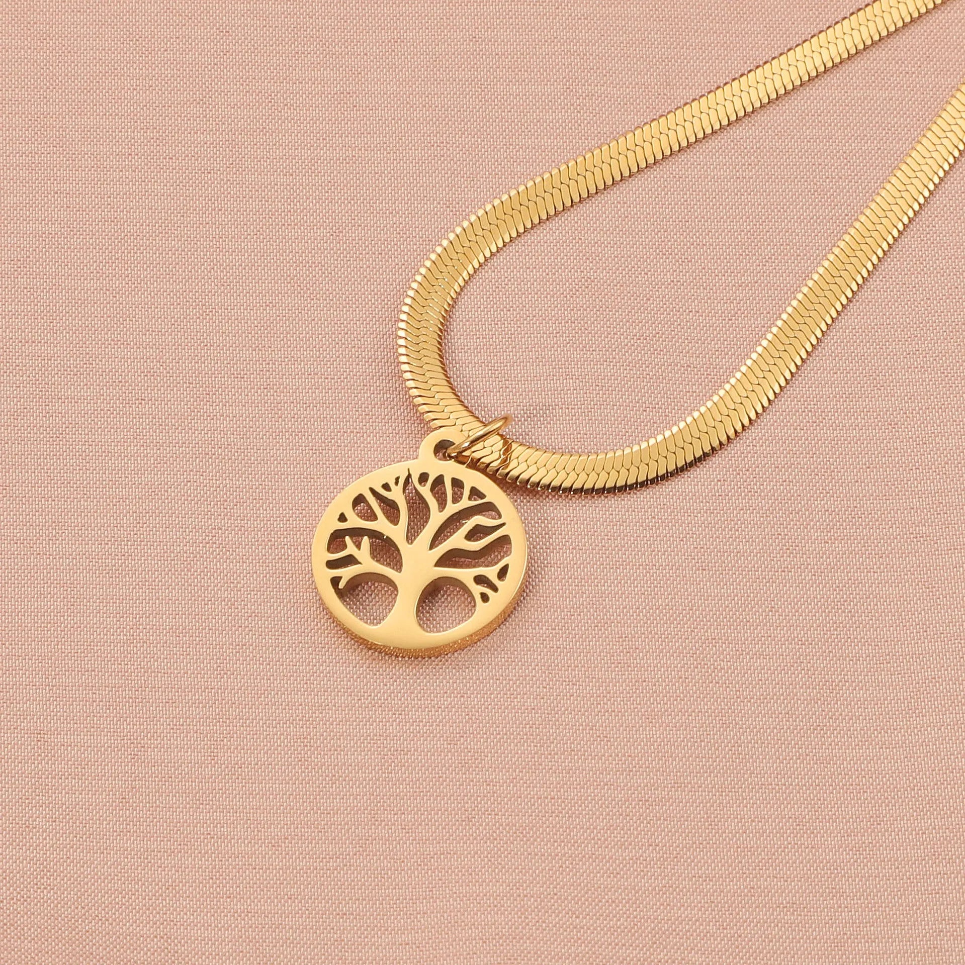 Stainless steel lucky tree necklace with snake bones chain, shown in gold and steel colour options.