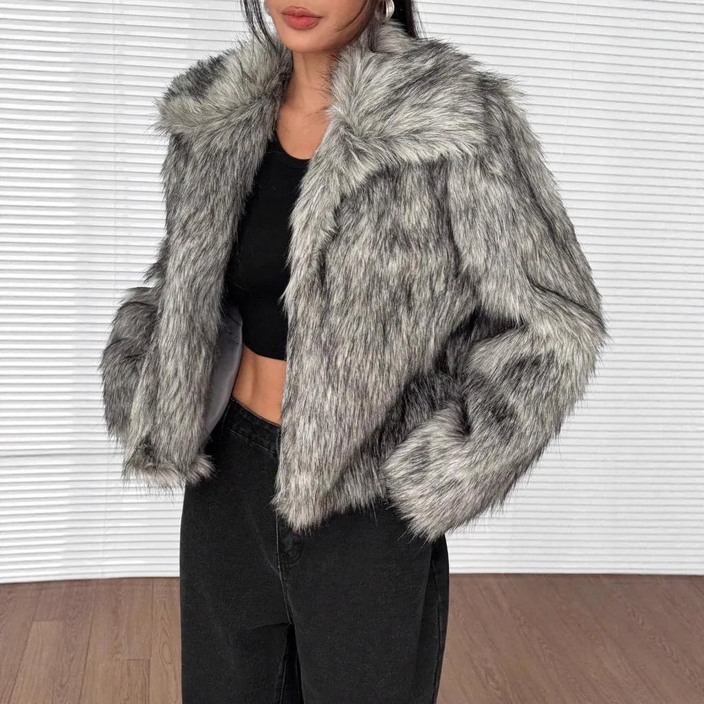 Artificial fox fur fashion coat with a fur collar and long sleeves in a short length.