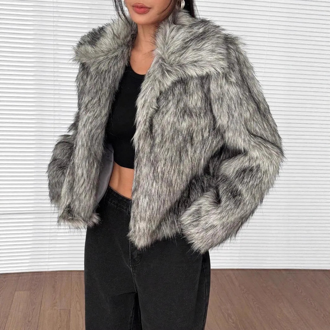 Artificial fox fur fashion coat with a fur collar and long sleeves in a short length.