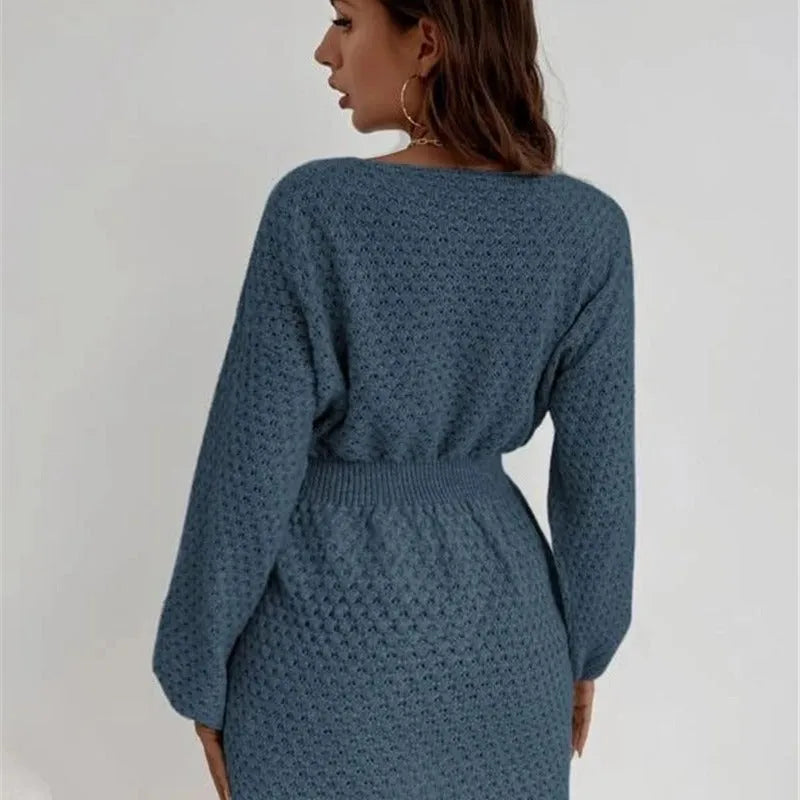 Blue women's slim-fit knitted dress with hand-crocheted flowers and a fitted waist.