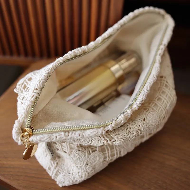 Handmade crocheted hollow flower cosmetic bag with ethnic embroidery patterns on corduroy fabric