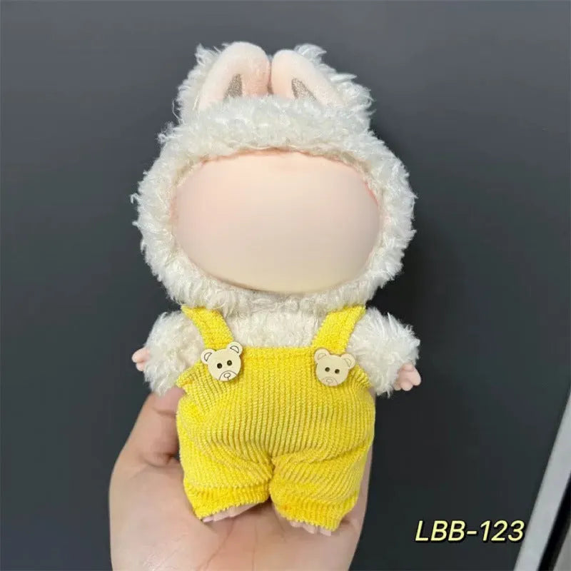 Plastic clothing outfit for a 17cm tall vinyl figure or doll on a display stand.