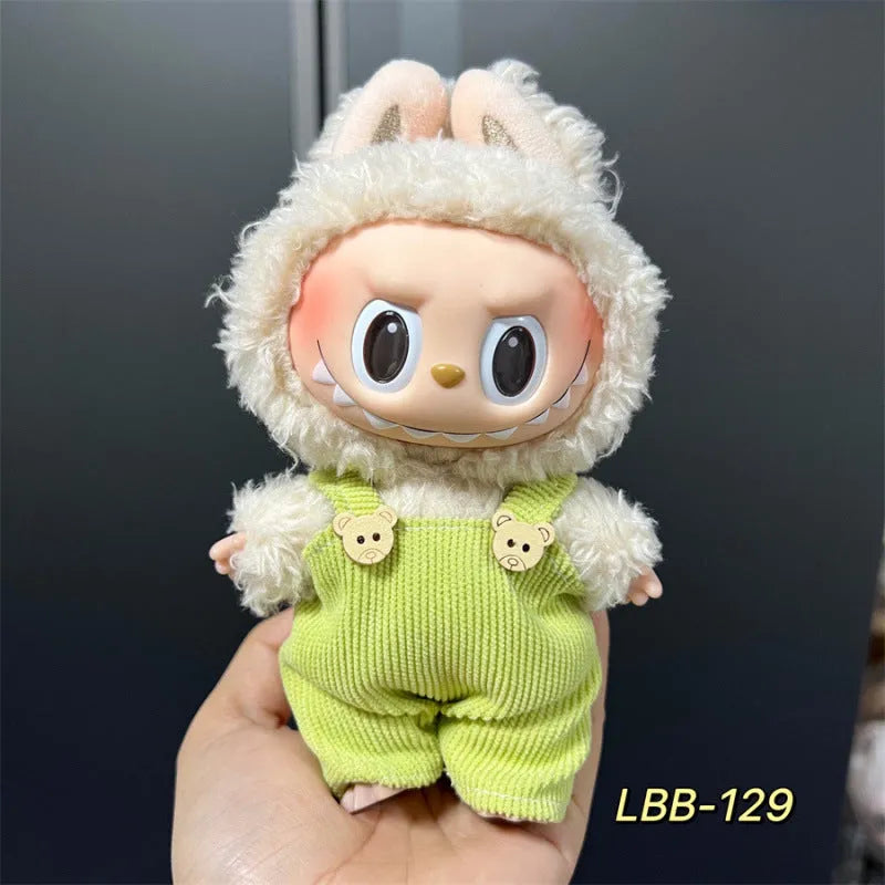 Plastic clothing outfit for a 17cm tall vinyl figure or doll on a display stand.