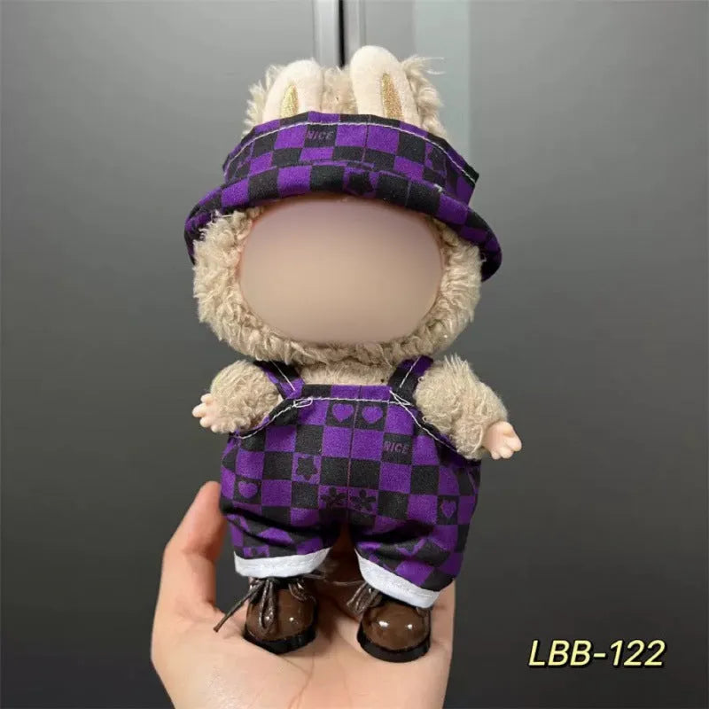 Plastic clothing outfit for a 17cm tall vinyl figure or doll on a display stand.