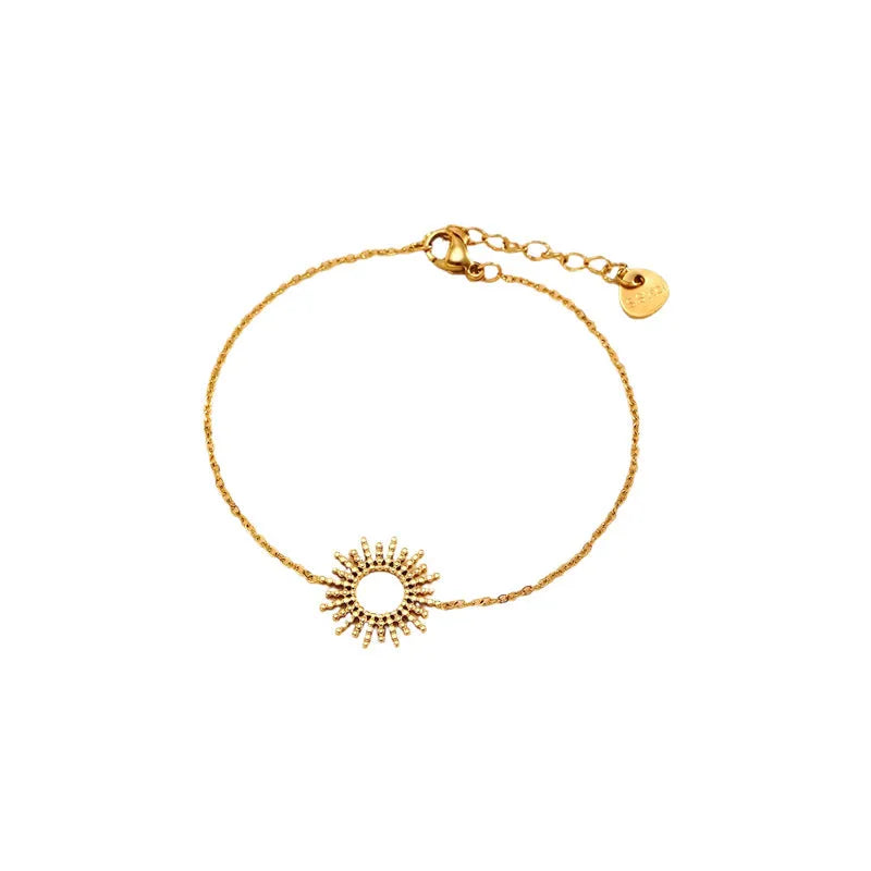 Gold geometric chain necklace and bracelet set for women on a plain background.