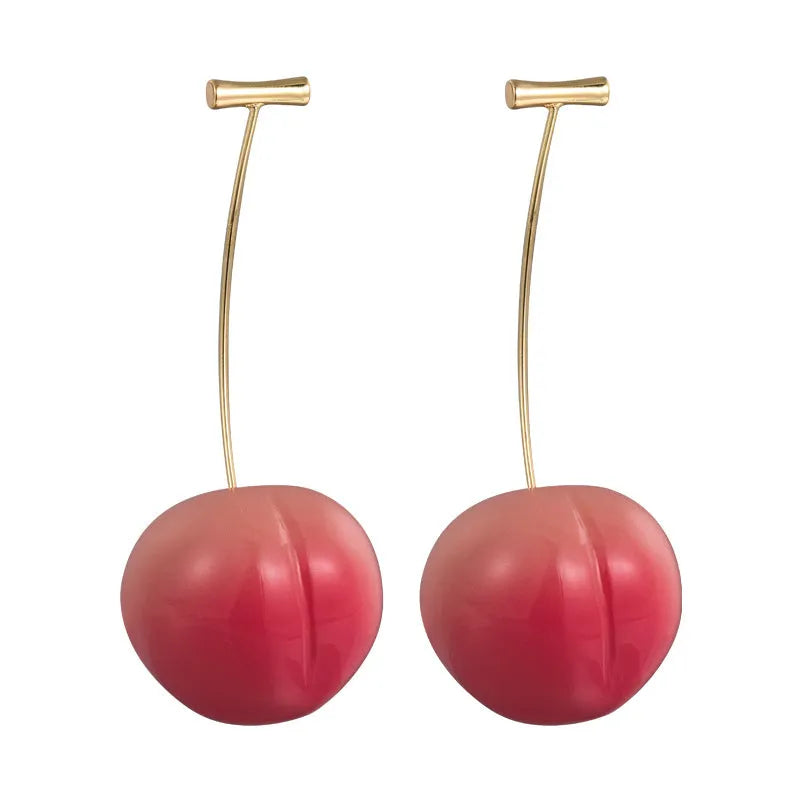 A pair of peach-shaped acrylic earrings on copper studs, shown in small and large size options.