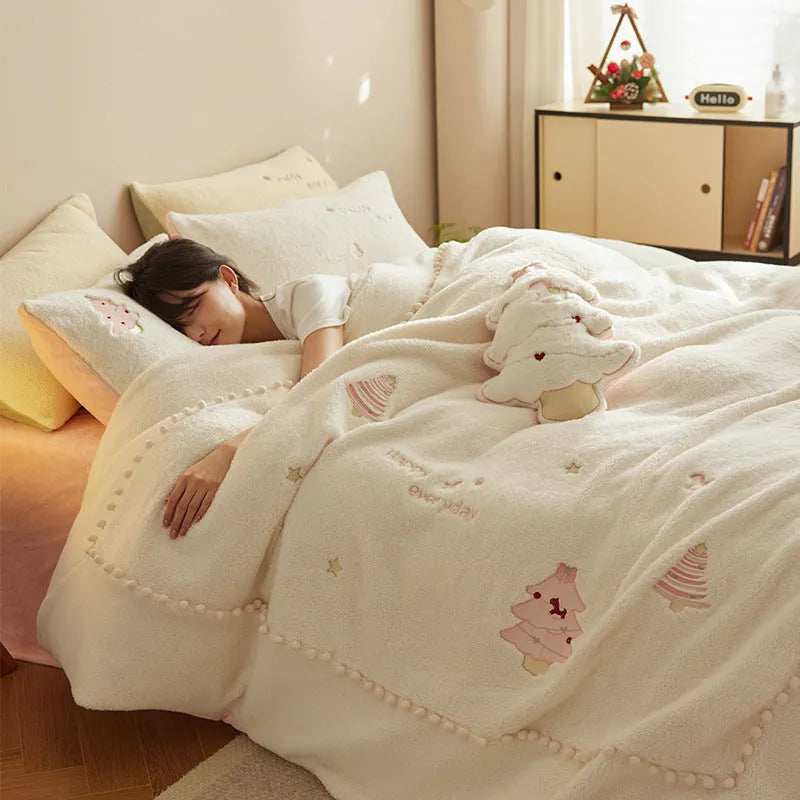 Milk fibre four-piece bedding set with green Christmas tree pattern on a duvet cover and pillowcases.