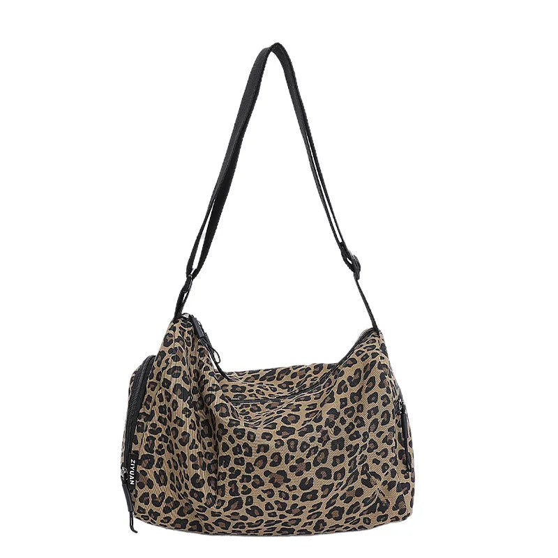 Leopard print sports style shoulder messenger bag with crossbody strap and striped lining