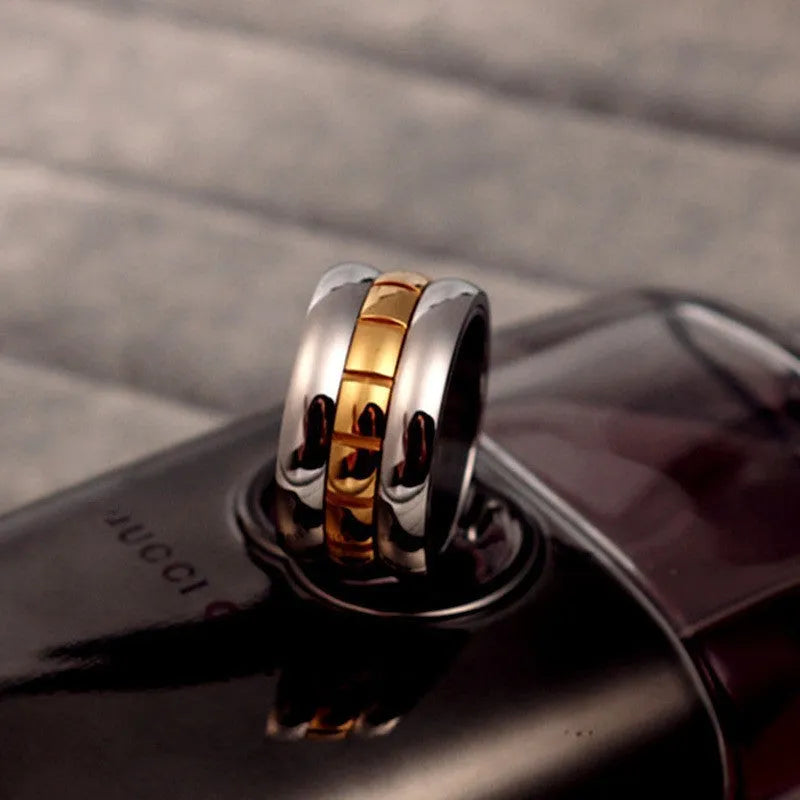 Ultra-wide gold titanium steel knuckle ring with rotating band on hand