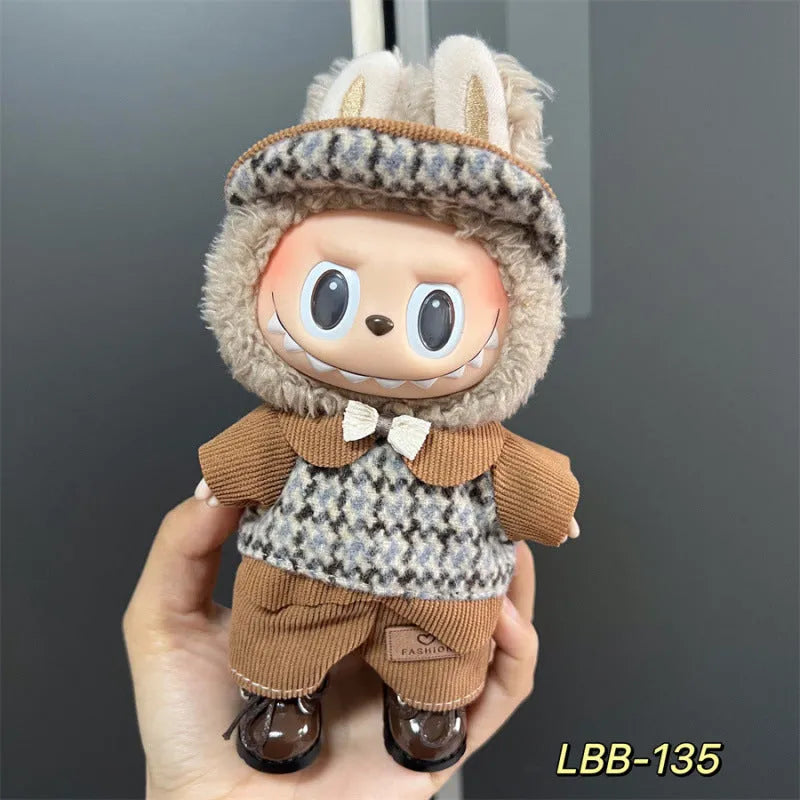 Plastic clothing outfit for a 17cm tall vinyl figure or doll on a display stand.