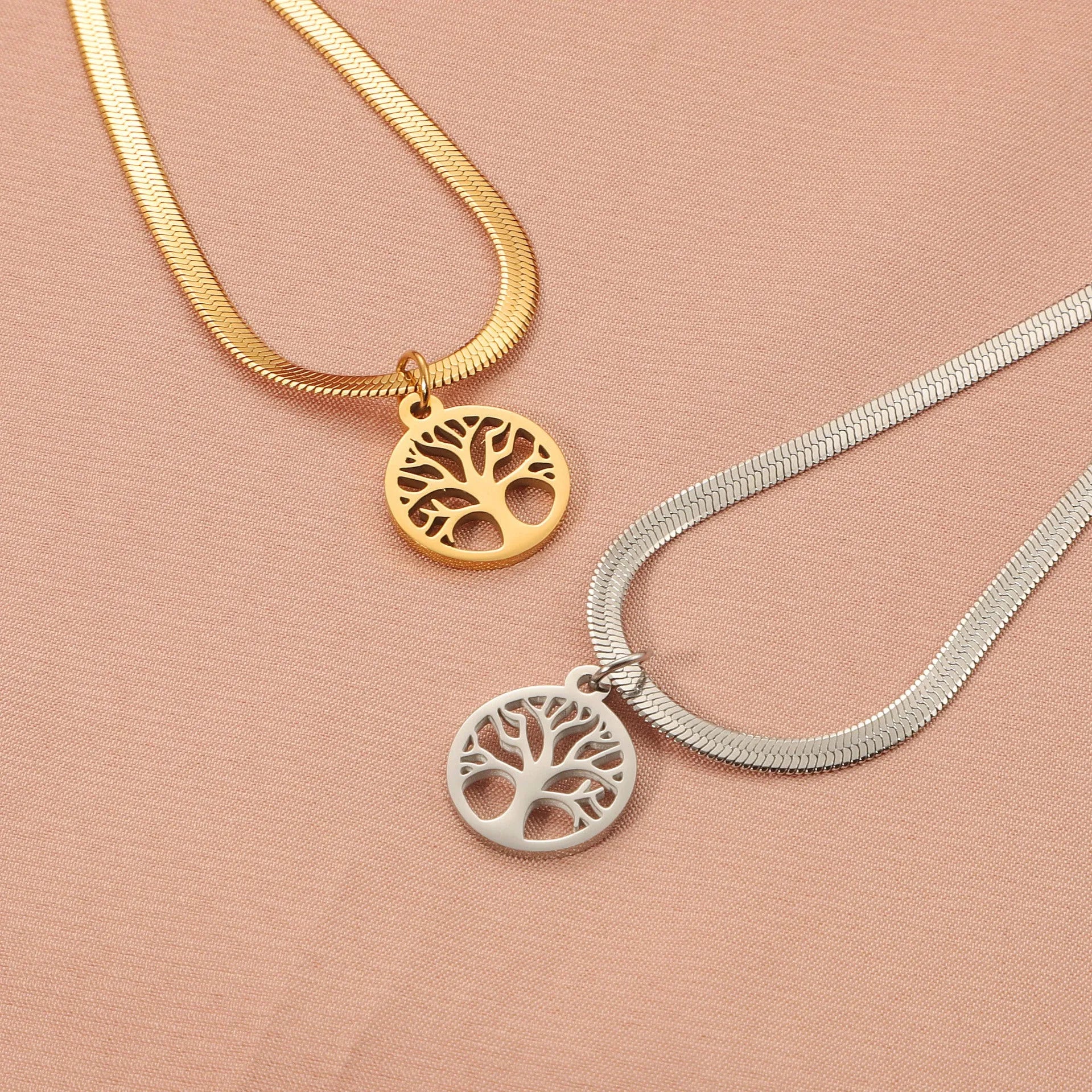 Stainless steel lucky tree necklace with snake bones chain, shown in gold and steel colour options.