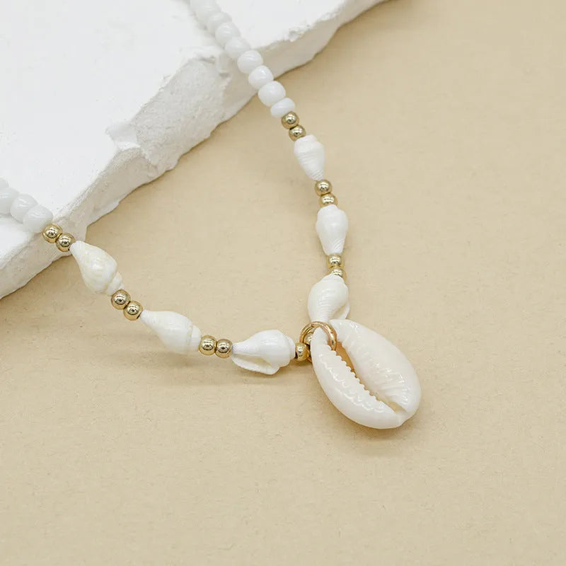 White conch bead necklace with mother pearl shellfish pendant on regular chain