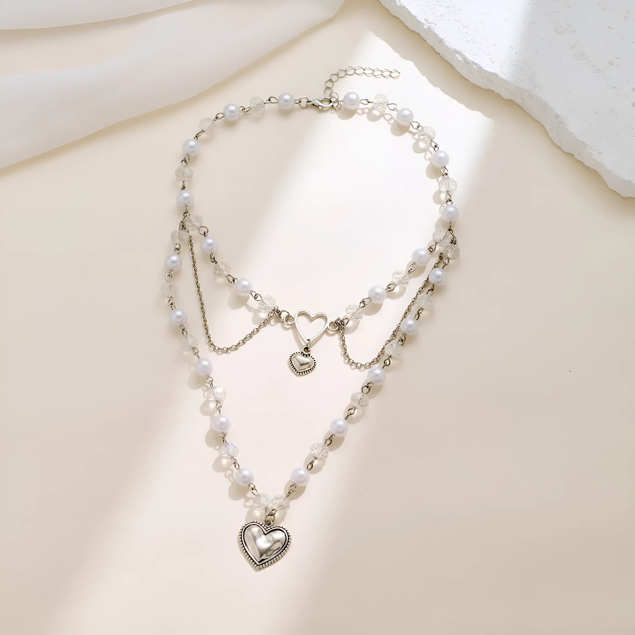 Women's retro alloy love heart pendant necklace with multi-layer pearl chain and double-layer heart design