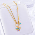 Gold colour titanium steel necklace and bracelet set with a detailed epoxy butterfly charm.