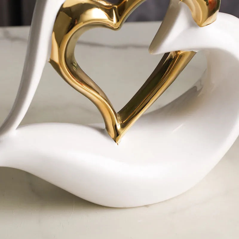 Modern white porcelain heart ornament on display in a choice of eight metallic and coloured finishes.