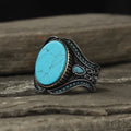 Men's antique silver alloy ring with turquoise decorative detail on a circular band
