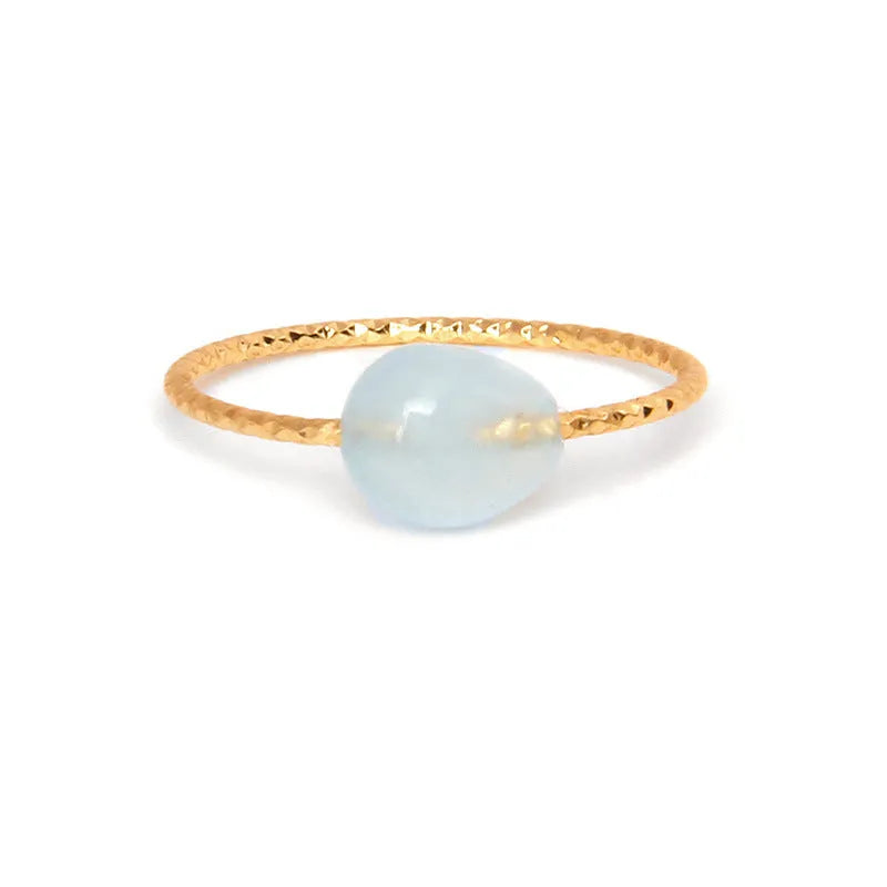 A women's ring featuring a geometric design set with a coloured agate stone.