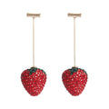 Geometric red strawberry stud earrings with spot-drill texture on a zinc alloy charm.