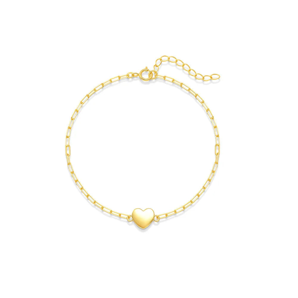 S925 sterling silver bracelet with clip chain fastening and glossy gold heart charm