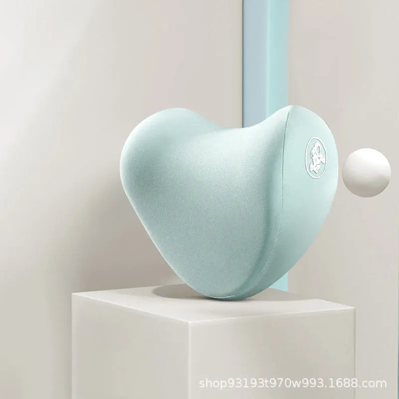 Heart-shaped car pillow in choice of colours, shown as headrest and lumbar support on a car seat.