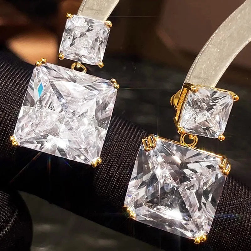 A pair of women's geometric square earrings in copper with a choice of white gold or gold colour finish.