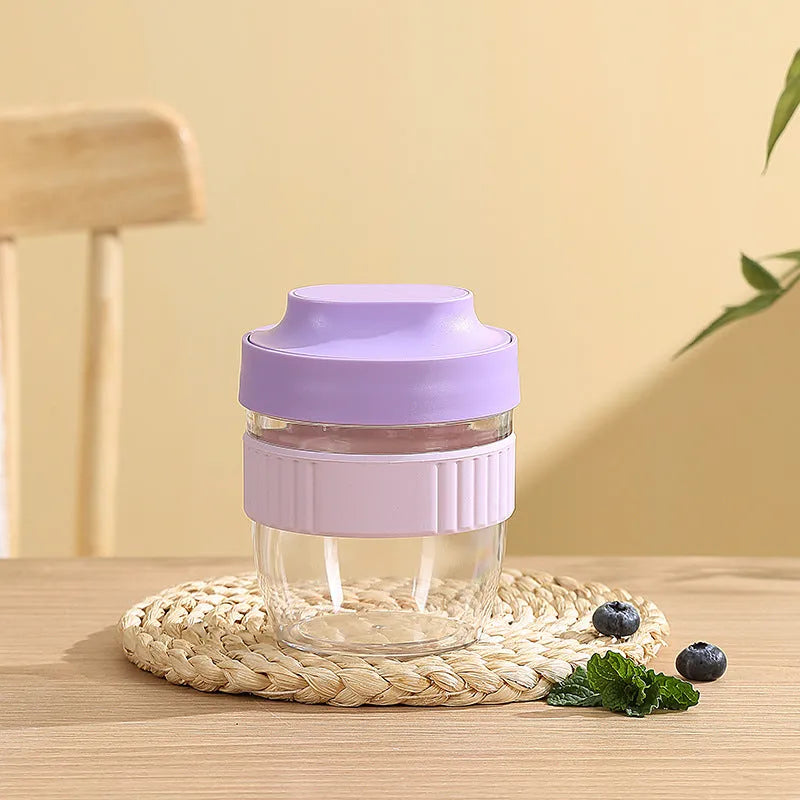 Modern simplicity plastic salad cup with lid and spoon in green, shown next to purple and pink options.