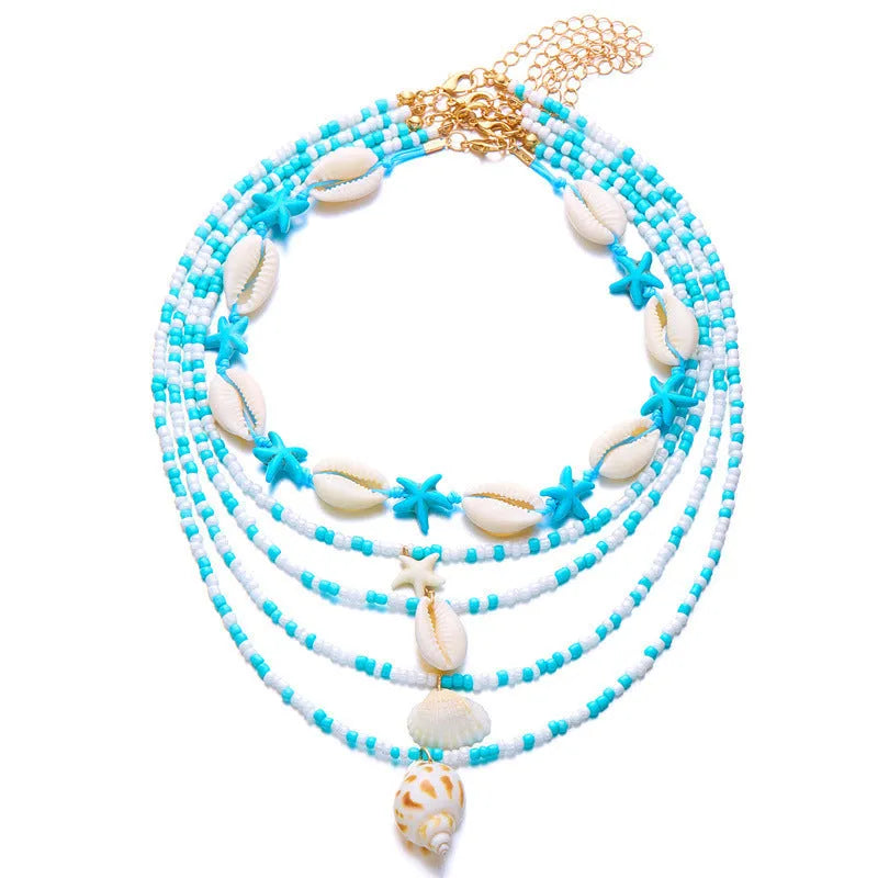 Five-piece women's necklace set with starfish shell and conch bead designs on adjustable chain