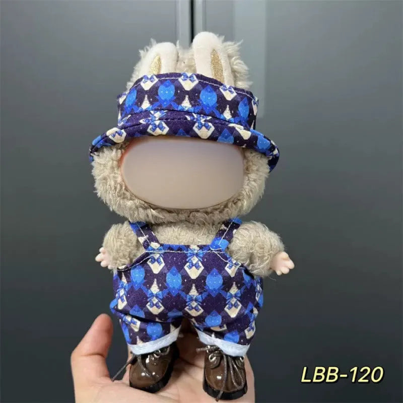 Plastic clothing outfit for a 17cm tall vinyl figure or doll on a display stand.