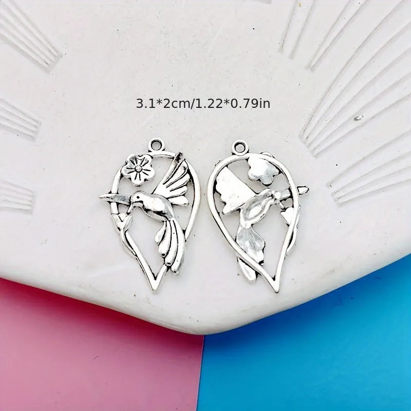 Silver-toned alloy DIY pendant with detailed magpie pattern, shown against a plain background.