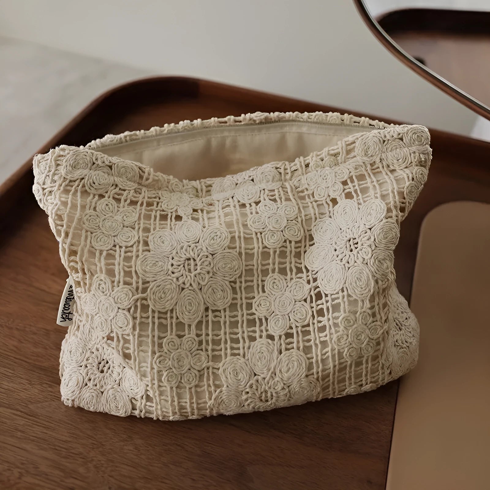 Handmade crocheted hollow flower cosmetic bag with ethnic embroidery patterns on corduroy fabric